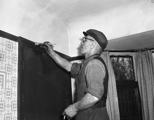 Painter and decorater seen here at work circa April 1959