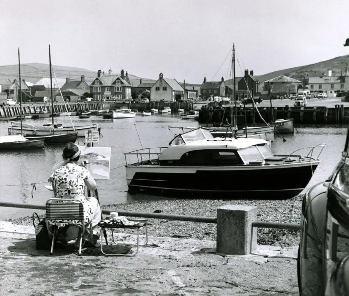 Framed Print : Painter painting seascapes and boat scenes at a seaside resort Circa 1960 Framed Print : Painter painting seascapes and boat scenes at a seaside resort Circa 1960