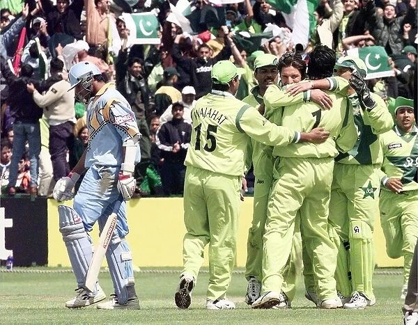 Pakistans Wasim Akram mobbed by team mates June 1999 After Taking The Wicket