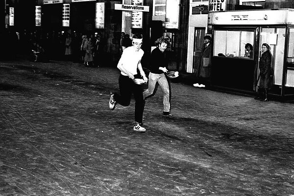 A pancake race at Newcastle Central Station on 15th February 1983