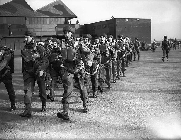 Parachutists kitted up for military exercise during WW2. Circa 1942
