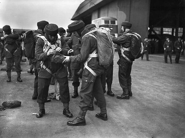 Paratroop Training at RAF Ringway, Manchester. England. Paratroopers checking each