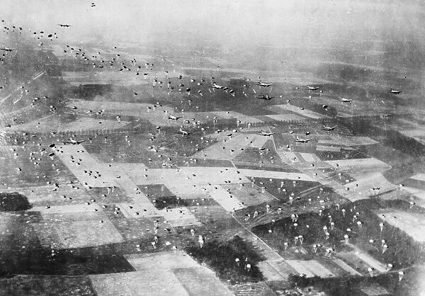 Paratroopers drop from C-47 transport planes in the Rees-Wesel area of Germany