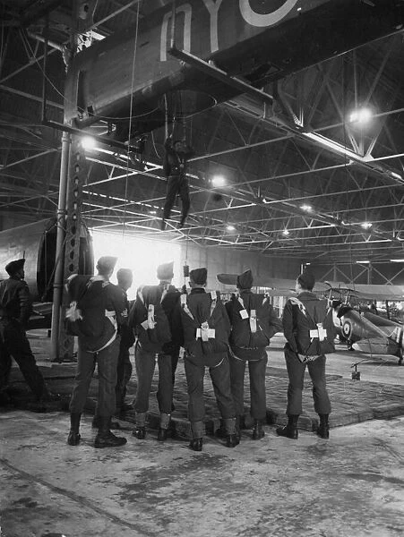 Paratroops under instruction at an RAF base in Britain where the Army