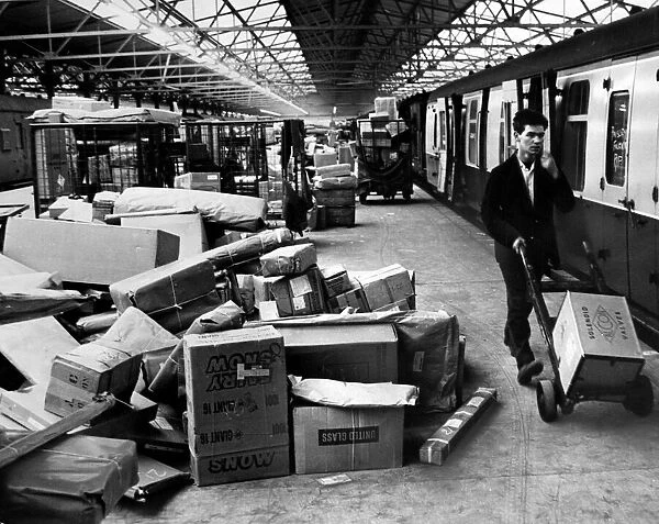 Parcels pile up at Curzon Street goods depot in Birmingham last night as the go-slow