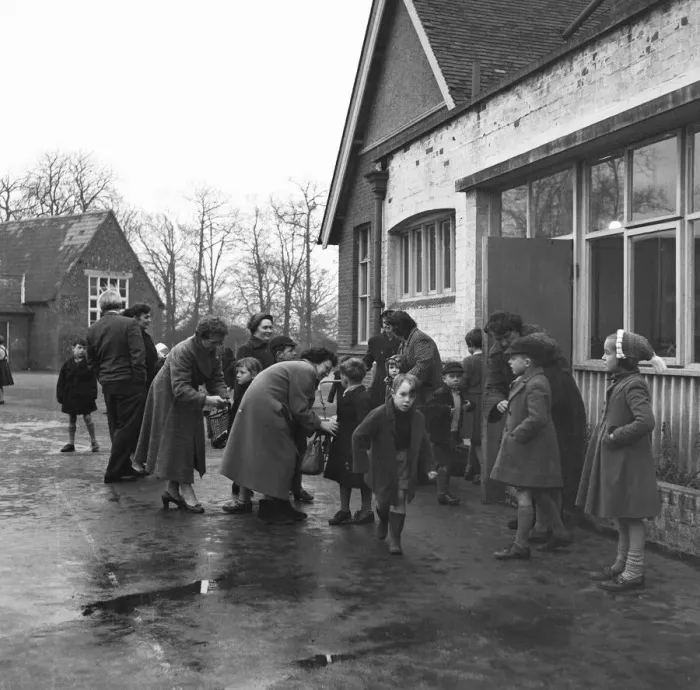 Framed Print : Parents collecting their children from school. 6th December 1957