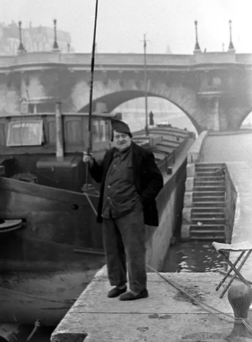 Framed Print : Paris street scenes - Man holding a fishing rod circa 1951 Framed Print : Paris street scenes - Man holding a fishing rod circa 1951