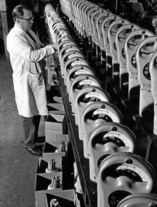 Framed Print : Parking Meters being checked using a stopwatch in the factory prior to dispatch all Framed Print : Parking Meters being checked using a stopwatch in the factory prior to dispatch all
