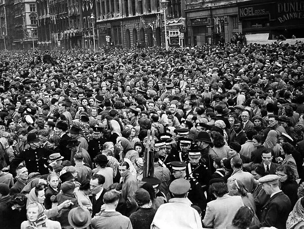 Parliament Street and Whitehall after the Victory procession has passed. 8th May 1945
