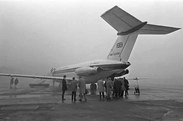 Passengers board a British United Airlines BAC 1-11 on a misty morning at Gatwick for a