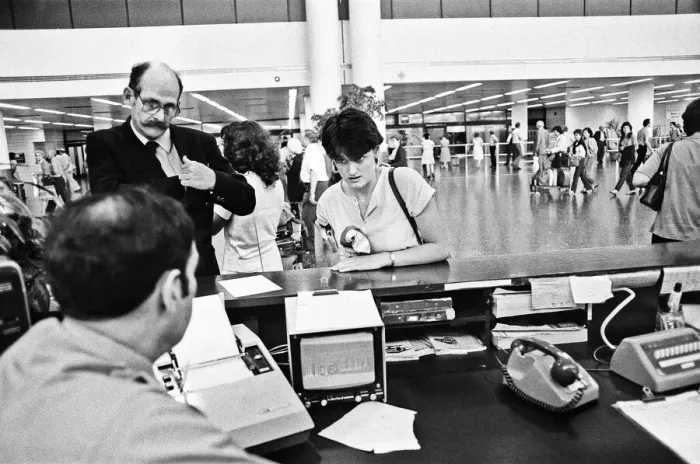 Framed Print : Passengers booking in their luggage at Gatwick Airport. 21st June 1983 Framed Print : Passengers booking in their luggage at Gatwick Airport. 21st June 1983