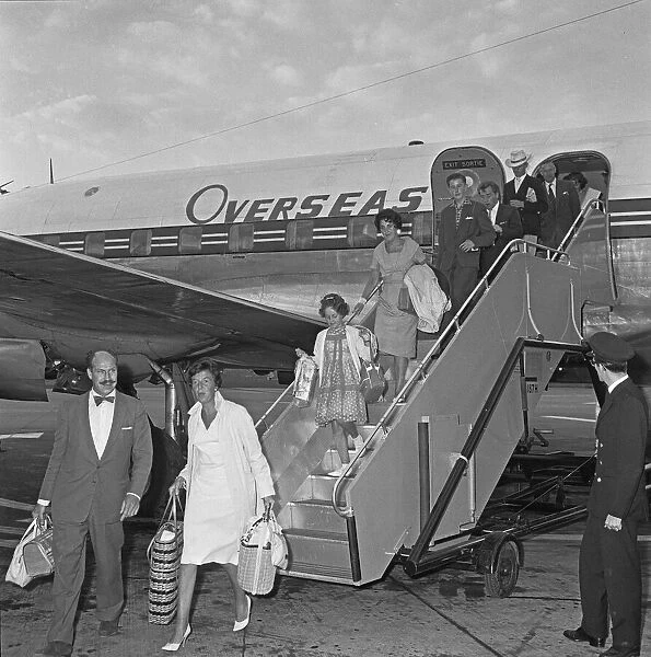 Passengers disembarking from an Overseas Aviation charter flight from the continent to