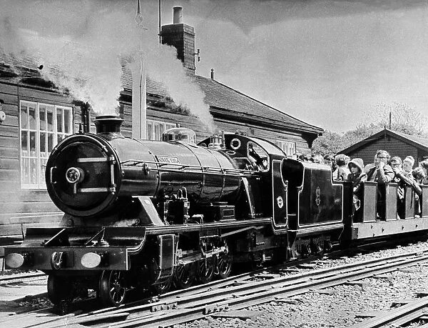 Passengers ride on the miniature engine and carriages on the Ravenglass