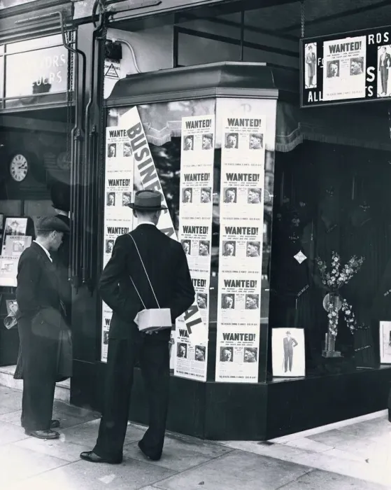 Framed Print : A passer-by look at a tailor shop window plastered with copies of the Daily Mirror Hitler Framed Print : A passer-by look at a tailor shop window plastered with copies of the Daily Mirror Hitler