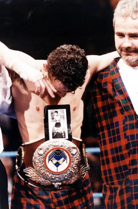 Framed Print : Pat Clinton boxer 1992 WBO flyweight champion Pat Clinton with picture of his late Framed Print : Pat Clinton boxer 1992 WBO flyweight champion Pat Clinton with picture of his late