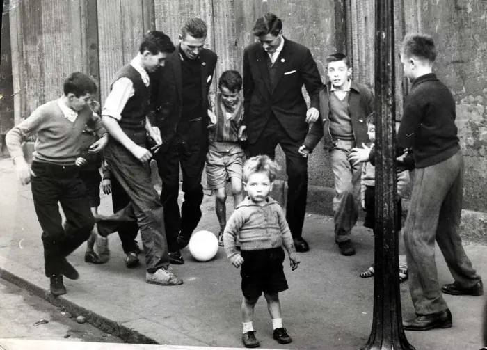 Framed Print : Pat Crerand with kids in the street 1960 pat Crerand on left football children