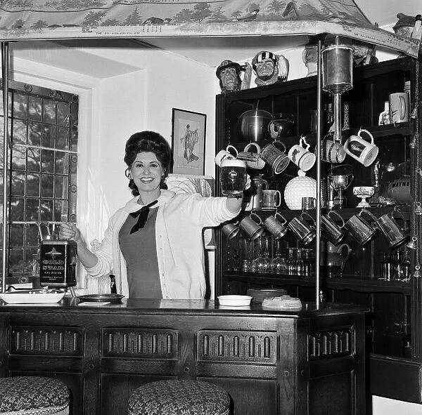 Pat Phoenix at home in her bar. 16th April 1968