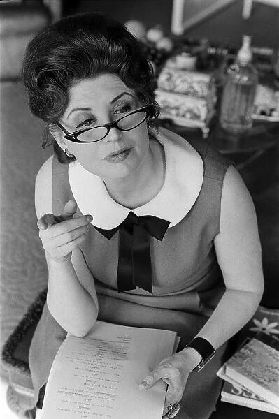 Pat Phoenix at home, reading her script. 16th April 1968
