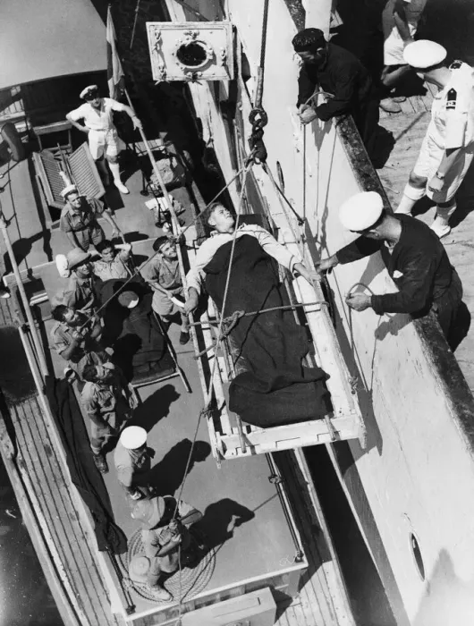 Framed Print : Patient being hoisted aboard the Maine from a hospital boat. 11th December 1943 Framed Print : Patient being hoisted aboard the Maine from a hospital boat. 11th December 1943