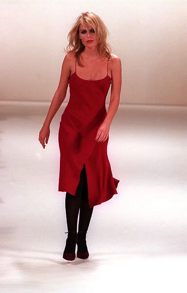 Patsy Kensit models Ben de Lisi design on the catwalk - wearing a red chiffon dress with