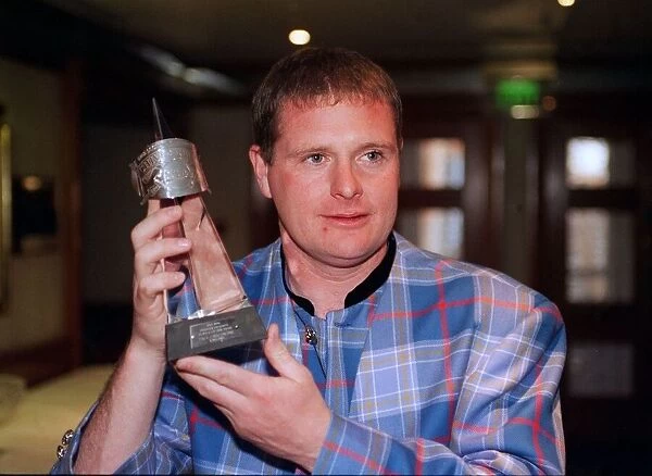 Paul Gascoigne Rangers football player with award trophy