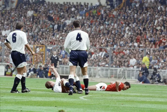 Framed Print : Paul Gascoigne of Tottenham Hotspur Football Club lies on the ground waving to