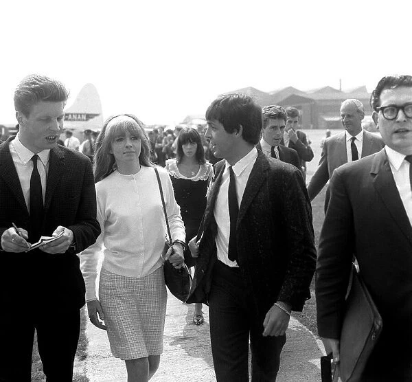 Paul McCartney and actress Jane Asher arriving at Luton Airport, May 1964