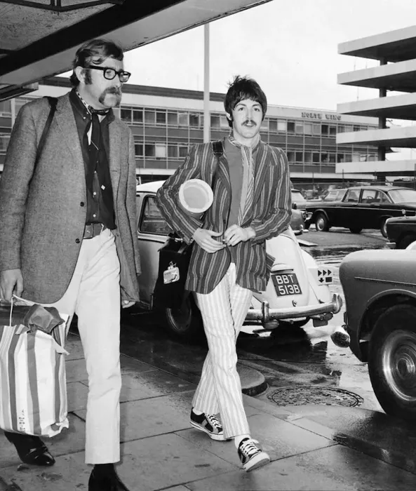 Framed Print : Paul McCartney, with Beatles assistant Mal Evans, returns to London Airport Framed Print : Paul McCartney, with Beatles assistant Mal Evans, returns to London Airport