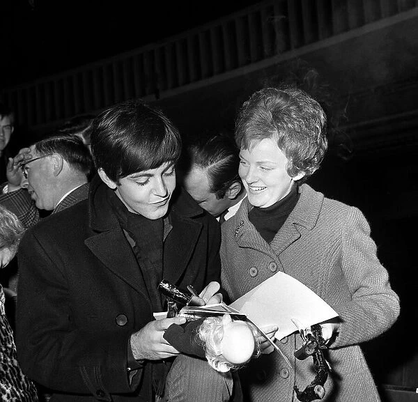 Paul McCartney of The Beatles with a fan at the Ritz Cinema Belfast in Northern Ireland