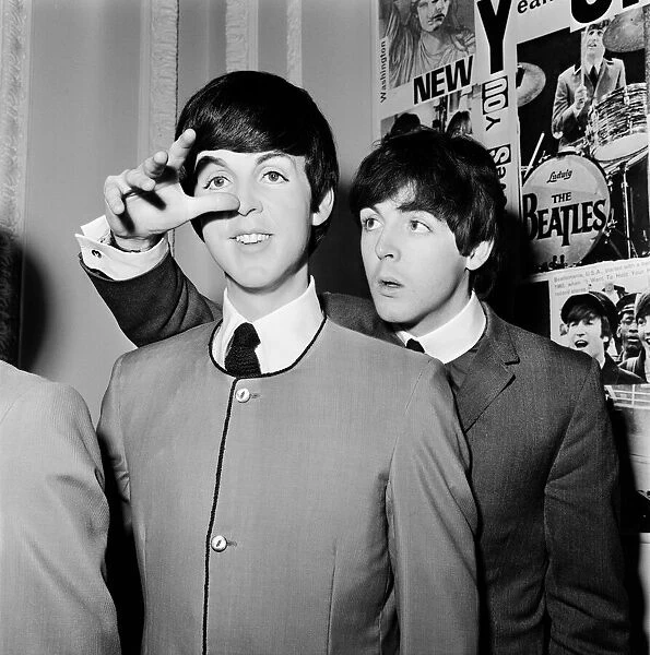 Paul McCartney of The Beatles at Madame Tussards to examine his waxwork doubles
