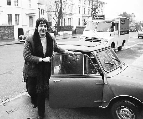 Paul McCartney of the Beatles with his mini car 27th December 1967
