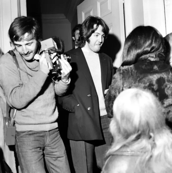 Framed Print : Paul McCartney of the Beatles smiles to console waiting girls outside the Apple