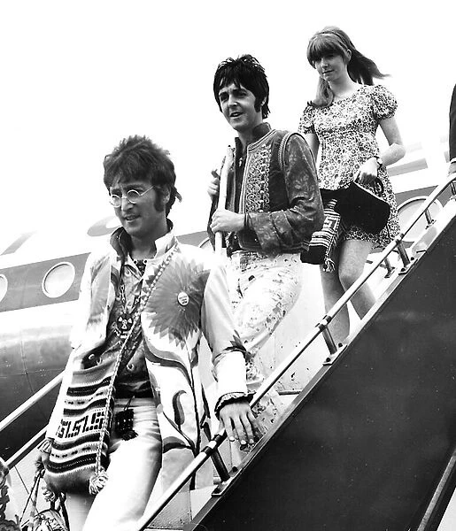 Paul McCartney (centre) with girlfriend Jane Asher and John Lennon disembark their plane