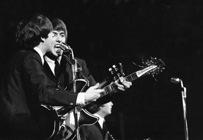 Framed Print : Paul McCartney and George Harrison in concert on the second night of their US tour
