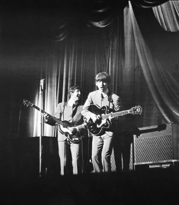 Framed Print : Paul McCartney and George Harrison onstage as The Beatles play at ABC Cinema, Northampton