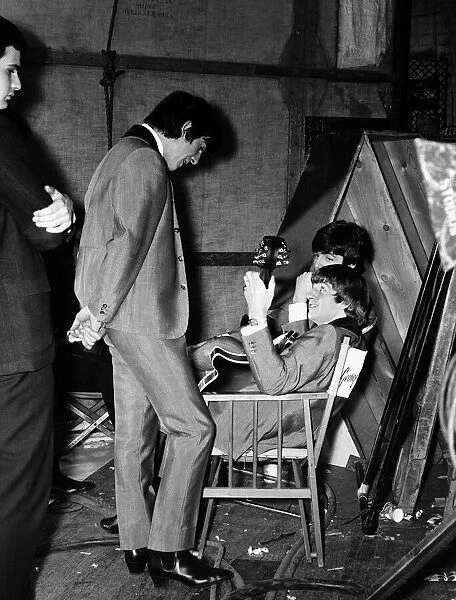 Paul McCartney, George Harrison and Ringo Starr of the Beatles backstage of The Scala