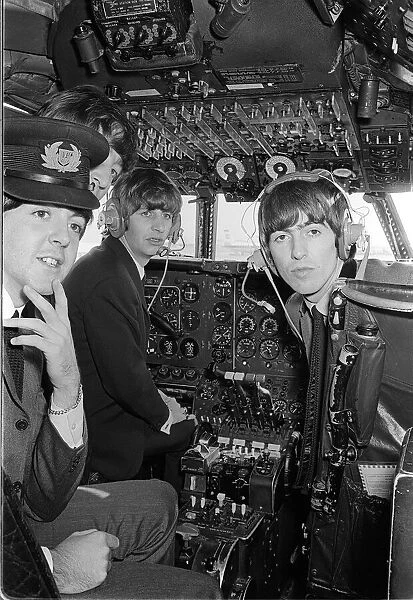 Paul McCartney, George Harrison and Ringo Starr in the cockpit on the plane bound for