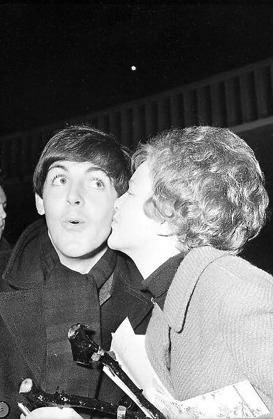 Paul McCartney gets a kiss from a fan at the Ritz Cinema Belfast 8 November 1963