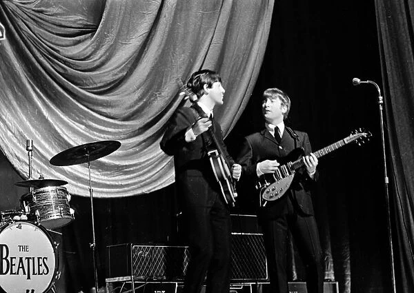 Paul McCartney and John Lennon of The Beatles performing on stage in Carlisle