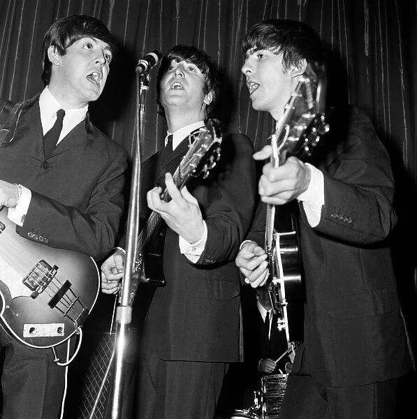 Paul McCartney, John Lennon and George Harrison of the Beatles seen here performing