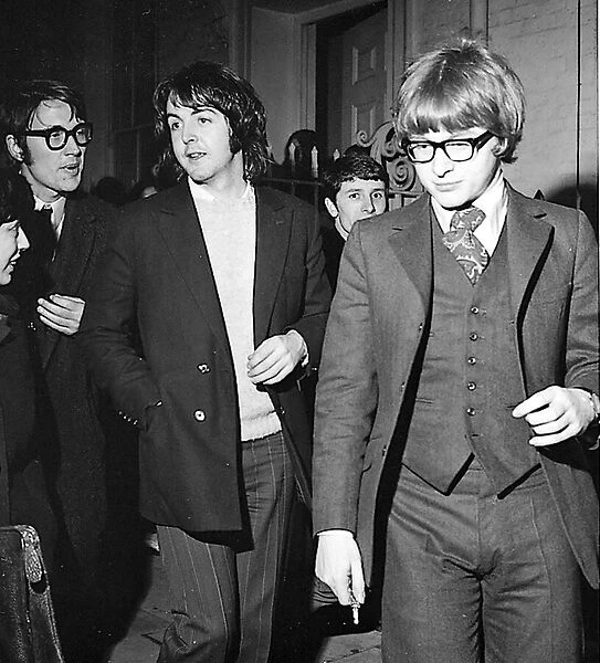 Paul McCartney with Peter Asher leaving Apples offices February 1969