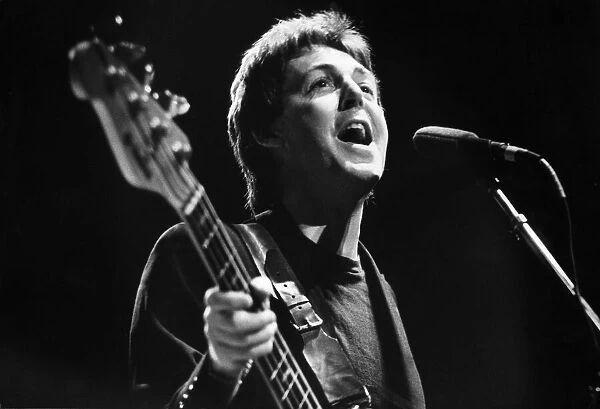 Paul McCartney pictured performing with Wings, in a concert at The Royal Court Theatre in