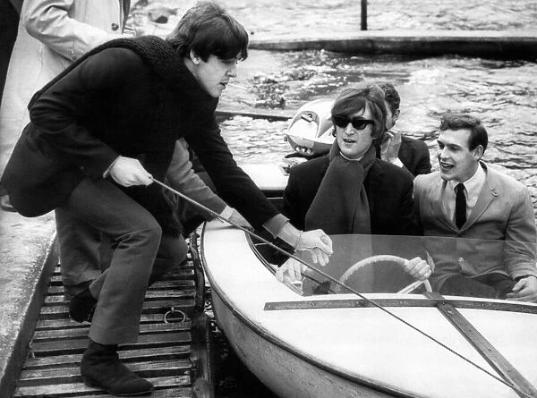 Paul McCartney pulls a boat into the jetty which John Lennon had been out on Loch Earn