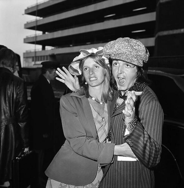 Paul McCartney seen here with his wife Linda at Heathrow Airport. April 1975 75-1772-003