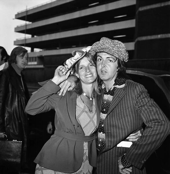 Paul McCartney seen here with his wife Linda at Heathrow Airport. April 1975 75-1772-001