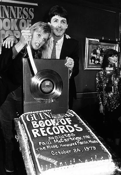 Paul McCartney former singer with The Beatles and wife Linda at the Guinness book of
