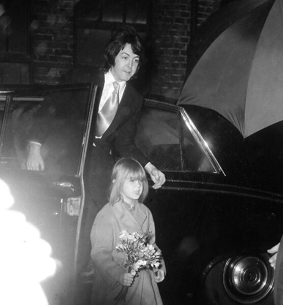 Paul McCartney, with six-year-old stepdaughter Heather, on his and Linda