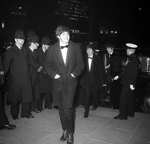 Paul McCartney smiles as the group arrive at the Empire Ballroom in Leicester Square for