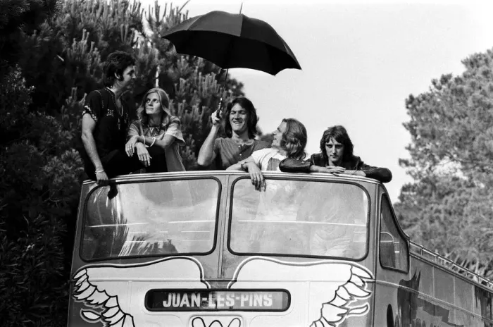 Framed Print : Paul McCartney and his wife Linda in Paris, France, with other members of the group Wings