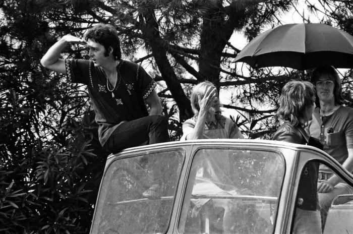 Framed Print : Paul McCartney and his wife Linda in Paris, France, with other members of the group Wings